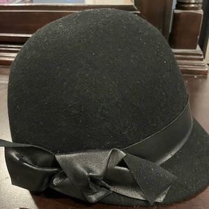 Black bowler hat with faux black leather bow